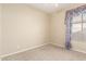 Bedroom with carpet flooring, neutral walls, and a window with curtains at 4109 E Del Rio St, Gilbert, AZ 85295