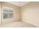 Carpeted bedroom with a ceiling fan and natural light at 4109 E Del Rio St, Gilbert, AZ 85295