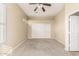 Bedroom with carpet flooring, double closets, and a ceiling fan at 4109 E Del Rio St, Gilbert, AZ 85295