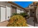 Inviting entrance with a tiled walkway surrounded by colorful, mature landscaping at 4109 E Del Rio St, Gilbert, AZ 85295