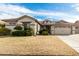 Charming single-story home with well-manicured landscaping and a two-car garage in a suburban neighborhood at 4109 E Del Rio St, Gilbert, AZ 85295