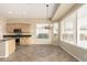 Bright eat-in kitchen area with wood cabinets, stainless appliances, and ample natural light from large windows at 4109 E Del Rio St, Gilbert, AZ 85295