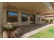 Covered patio with views of the green lawn, perfect for outdoor entertaining at 4109 E Del Rio St, Gilbert, AZ 85295