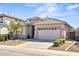 Well-maintained home with desert landscaping, a two-car garage, and a charming curb appeal at 43851 W Griffis Dr, Maricopa, AZ 85138