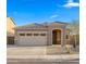 Charming single-story home featuring a desert-friendly landscaped front yard and attached two-car garage at 4521 W Kirkland Ave, San Tan Valley, AZ 85144