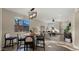 Inviting living room with a round dining table, stylish chandelier, and comfortable seating at 4521 W Kirkland Ave, San Tan Valley, AZ 85144