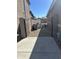 View of the side yard featuring a gravel path and gate access, providing privacy and functionality at 4521 W Kirkland Ave, San Tan Valley, AZ 85144