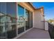 Balcony with large sliding glass doors and neighboring view at 4655 S Glacier --, Mesa, AZ 85212