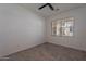 Bedroom with carpet, big window and ceiling fan at 4655 S Glacier --, Mesa, AZ 85212