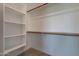 Walk-in closet offering ample storage with shelves and hanging rods for organization at 4655 S Glacier --, Mesa, AZ 85212