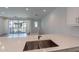 Bright kitchen island view with quartz countertop and stainless steel faucet at 4655 S Glacier --, Mesa, AZ 85212