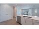 Open kitchen view with an island featuring a stainless steel dishwasher and a large sink at 4655 S Glacier --, Mesa, AZ 85212