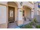 Inviting front porch with comfortable seating and arched entryway at 4655 S Glacier --, Mesa, AZ 85212