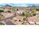 The aerial view features desert landscaping in a community, with homes boasting private pools and mountain views at 4662 W Fallen Leaf Ln, Glendale, AZ 85310