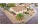 Aerial view of the home's landscaping showing the three-car garage and privacy fence at 4662 W Fallen Leaf Ln, Glendale, AZ 85310