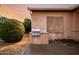 Outdoor barbecue area with a stainless steel grill and tiled counter at 4662 W Fallen Leaf Ln, Glendale, AZ 85310