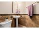 Bathroom featuring decorative tile accent and a pedestal sink at 4662 W Fallen Leaf Ln, Glendale, AZ 85310