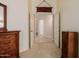 Bedroom view into hallway featuring carpeted floors and neutral-colored walls, promoting a bright and airy feel at 4662 W Fallen Leaf Ln, Glendale, AZ 85310