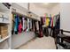 Well-organized walk-in closet with ample shelving and hanging space for clothes at 4662 W Fallen Leaf Ln, Glendale, AZ 85310