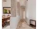 Inviting hallway with tile flooring and decorative columns leading into the home at 4662 W Fallen Leaf Ln, Glendale, AZ 85310