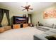 Comfortable living room with a large TV cabinet, neutral carpet, and ample seating at 4662 W Fallen Leaf Ln, Glendale, AZ 85310