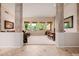 A view from the entryway into a spacious living and dining room features three large view windows at 4662 W Fallen Leaf Ln, Glendale, AZ 85310