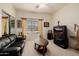 Comfortable living room with a leather sofa, and a TV at 4662 W Fallen Leaf Ln, Glendale, AZ 85310