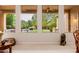 Living area features a view of the backyard waterfall, with ample natural light, and comfortable seating at 4662 W Fallen Leaf Ln, Glendale, AZ 85310