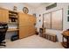 Functional office with built-in desk, Murphy bed, and cabinets for an organized workspace at 4662 W Fallen Leaf Ln, Glendale, AZ 85310