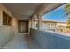 Charming covered front porch with tiled flooring and partial view of the home's exterior at 4747 W Sunnyside Ave, Glendale, AZ 85304