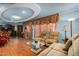 Cozy living room featuring hardwood floors, plush sofas, and decorative window coverings at 4747 W Sunnyside Ave, Glendale, AZ 85304