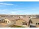 New construction neighborhood featuring homes with covered patios and fenced yards at 47737 W Coe St, Maricopa, AZ 85139