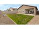 Expansive backyard with patio and decorative hardscape design at 47737 W Coe St, Maricopa, AZ 85139