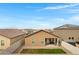 Home exterior featuring a covered patio with outdoor furniture and a fenced yard at 47737 W Coe St, Maricopa, AZ 85139