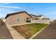 Spacious backyard with rock border, patio, and block wall at 47737 W Coe St, Maricopa, AZ 85139