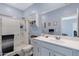 Well-lit bathroom with modern fixtures, a sleek vanity, and a glass-enclosed shower for a clean, spa-like experience at 47737 W Coe St, Maricopa, AZ 85139