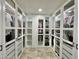 Large walk-in closet with ample storage and lighting at 5146 W Echo Ln, Glendale, AZ 85302