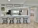 Modern kitchen featuring sleek countertops, stainless steel appliances, and bar stool seating at 5146 W Echo Ln, Glendale, AZ 85302