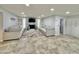 Bright living room with tile floors, a stone fireplace and two large sofas at 5146 W Echo Ln, Glendale, AZ 85302