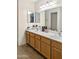 Bathroom featuring double sinks, tile floors and modern fixtures at 528 E Wolf Hollow Dr, Casa Grande, AZ 85122