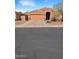 Charming single-story home with a desert-style landscaped front yard and a two-car garage at 528 E Wolf Hollow Dr, Casa Grande, AZ 85122