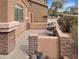 Charming front patio with brick detail, perfect for outdoor relaxation and enjoying the scenery at 528 E Wolf Hollow Dr, Casa Grande, AZ 85122