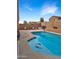 Enjoy the sparkling pool complete with dolphin tile, basketball hoop, and chairs for lounging at 528 E Wolf Hollow Dr, Casa Grande, AZ 85122