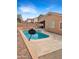 A private pool is showcased in a backyard oasis, complete with a basketball hoop for added entertainment at 528 E Wolf Hollow Dr, Casa Grande, AZ 85122