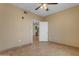 Bedroom features tile flooring and a ceiling fan for added comfort and style at 5401 E Van Buren St # 1103, Phoenix, AZ 85008