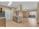 View of kitchen and stainless steel dishwasher, leading into the living room at 5401 E Van Buren St # 1103, Phoenix, AZ 85008