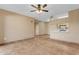 Spacious living room with tile flooring and ceiling fan, adjacent to the kitchen area at 5401 E Van Buren St # 1103, Phoenix, AZ 85008