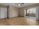 Living room with sliding glass door leading to balcony and a full-sized door at 5401 E Van Buren St # 1103, Phoenix, AZ 85008