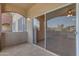 A covered patio with tile flooring and a view at 5401 E Van Buren St # 1103, Phoenix, AZ 85008