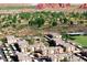 Aerial view of the apartment complex and surrounding desert landscape, mountains, and greenery at 5401 E Van Buren St # 2053, Phoenix, AZ 85008